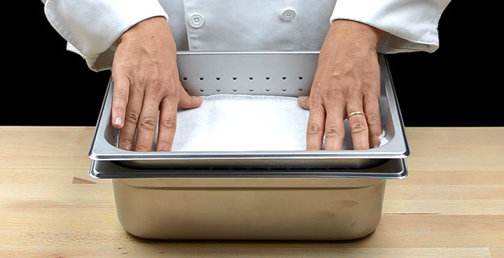 Tomato water clarified with cryofiltration - perforated pan with cheesecloth